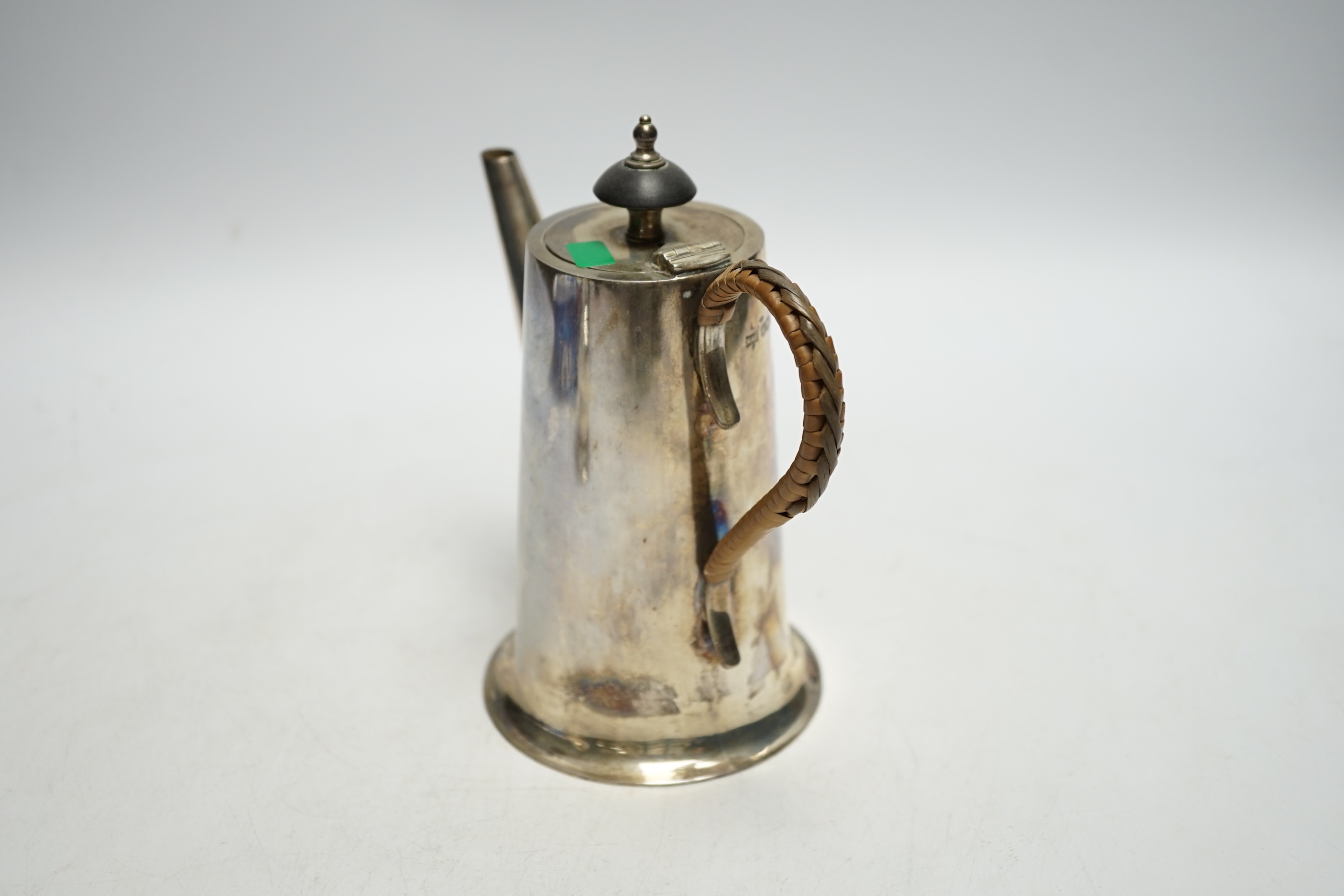 A George VI silver hot water pot, with rattan handle, Walker & Hall, Sheffield, 1937, height 15.7cm, gross weight 10.2oz.